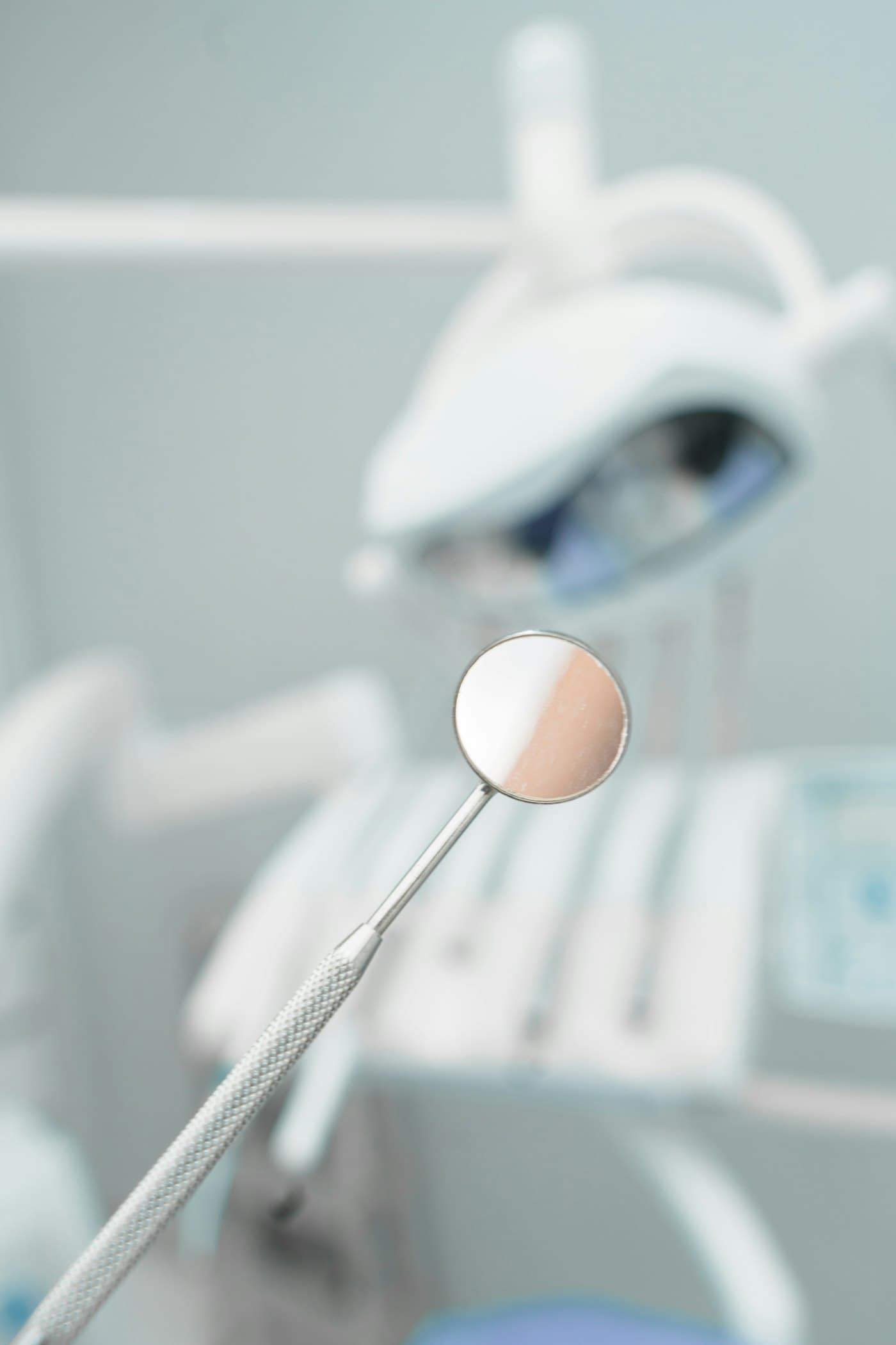 Dental mirror in front of a treatment chair